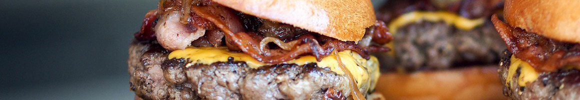 Eating Burger at Cheeburger Cheeburger STL restaurant in Des Peres, MO.